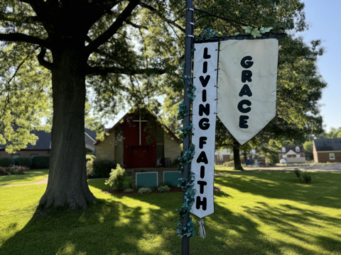 Living Faith and Grace Sign and Church Building